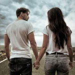 depositphotos_180676344-stock-photo-two-hitchhikers-walking-along-the
